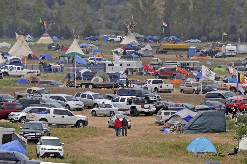 The Sacred Stones Overflow Camp is growing in size and number as more people arrive at the site along North Dakota Highway 1806 and across the Cannonball River from the Standing Rock Sioux Indian Reservation, Monday, Sept. 5, 2016 in Morton County, N.D.  (Tom Stromme/The Bismarck Tribune via AP)