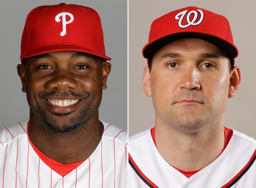 FILE - These are 2016 file photos showing Philadelphia Phillies' Ryan Howard, left, and Washington Nationals' Ryan Zimmerman. Al-Jazeera is asking a judge to dismiss defamation lawsuits filed by two Major League Baseball players over statements made in a documentary about performance-enhancing drugs in sports. Lawyers for the publication and for Ryan Zimmerman of the Washington Nationals and Ryan Howard of the Philadelphia Phillies are to appear in court Tuesday in U.S. District Court in Washington. The suits refer to the documentary "The Dark Side: Secrets of Sports Doping," which Al-Jazeera America broadcast in December 2015. (AP Photo/File)