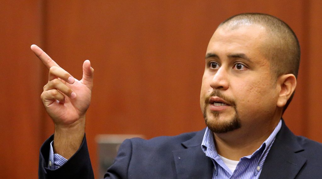 FILE - In this Sept. 22, 2015 file photo, George Zimmerman gestures during his testimony at a hearing for accused shooter Matthew Apperson in Seminole circuit court in Sanford, Fla. Testimony begins Tuesday, Sept. 13, 2016 in Apperson's attempted second-degree murder trial. Authorities say he shot at Zimmerman during a traffic incident last year. (Joe Burbank/Orlando Sentinel via AP, Pool)