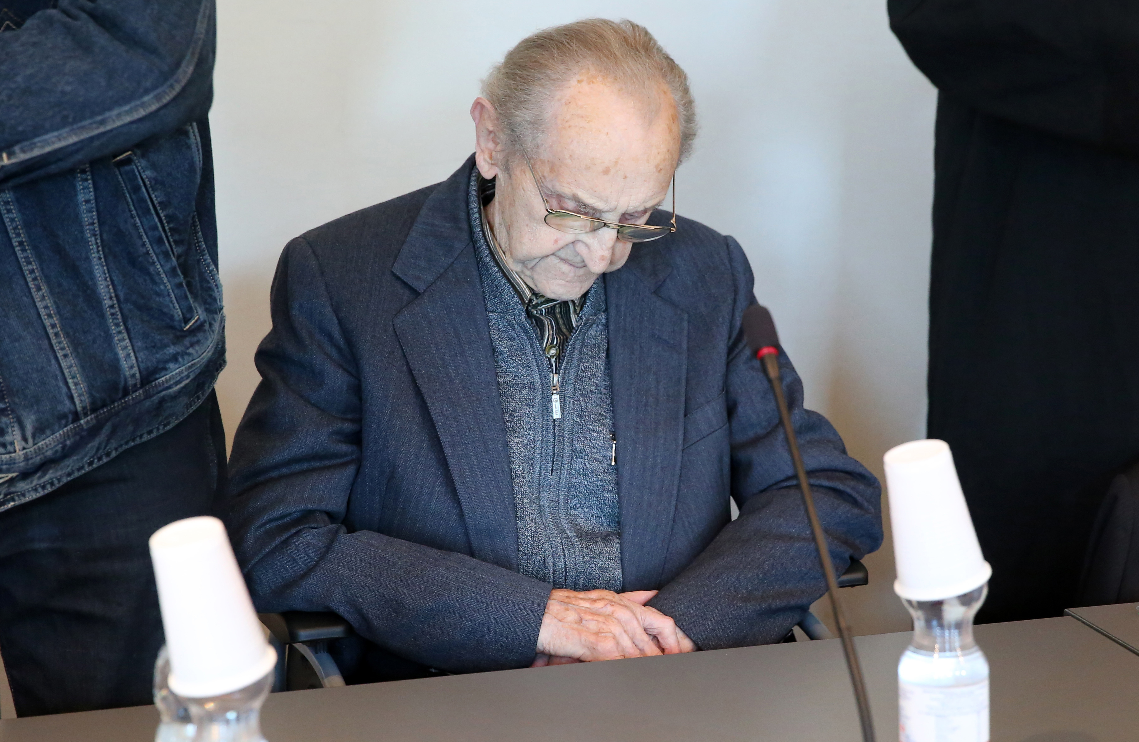 Hubert Zafke sits in a courtroom  ahead of his trial in Neubrandenburg, eastern Germany, Monday, Sept. 12, 2016.  The  former SS medic who served at the Auschwitz death camp has gone on trial in the northern German city of Neubrandenburg, though questions remain about whether the 95-year-old is fit enough for the proceedings to continue. The trial of Hubert Zafke, scheduled to start in February, had already been postponed three times after Presiding Judge Klaus Kabisch said his health was not good enough to proceed, based upon a doctors assessment.  (Bernd Wuestneck/dpa via AP)