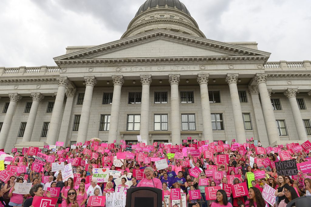 This Aug. 25, 2015, file photo, Karrie Galloway, CEO of Planned Parenthood Action Council, laughs as the roar of the crowd drowns out her speech at the state Capitol, in Salt Lake City. A judge is ordering the state of Utah not to stop funding its Planned Parenthood branch over advocacy for legal abortion or unproven allegations against the national organization. (Leah Hogsten/The Salt Lake Tribune via AP, File)