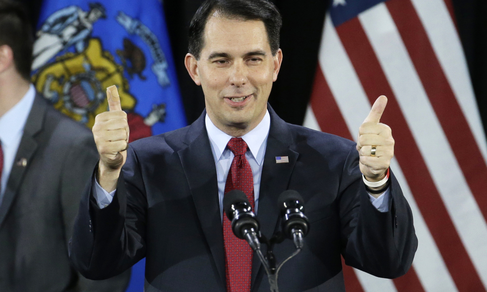 FILE - In a Tuesday, Nov. 4, 2014 file photo, Wisconsin Republican Gov. Scott Walker gives a thumbs up as he speaks at his campaign party, in West Allis, Wis. With Republicans holding even tighter control of the Wisconsin Legislature than before and Gov. Scott Walker enjoying his third statewide victory in four years, there is little to stop their agenda from moving quickly next year. (AP Photo/Morry Gash, File) ORG XMIT: NY112